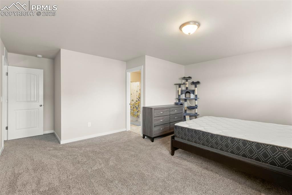 Image 16 of 27: Bedroom featuring carpet floors and baseboards