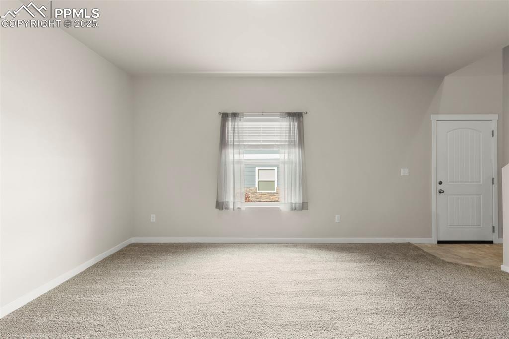 Image 2 of 27: Unfurnished room with light colored carpet
