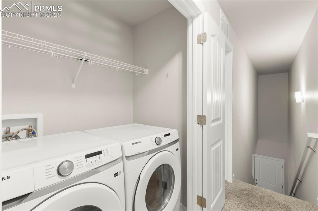Image 20 of 27: Washroom with washer and clothes dryer