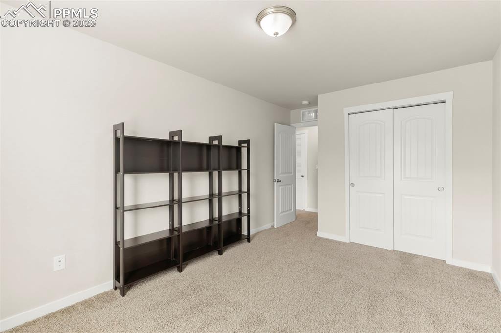 Image 22 of 27: Bedroom featuring carpet flooring and a closet
