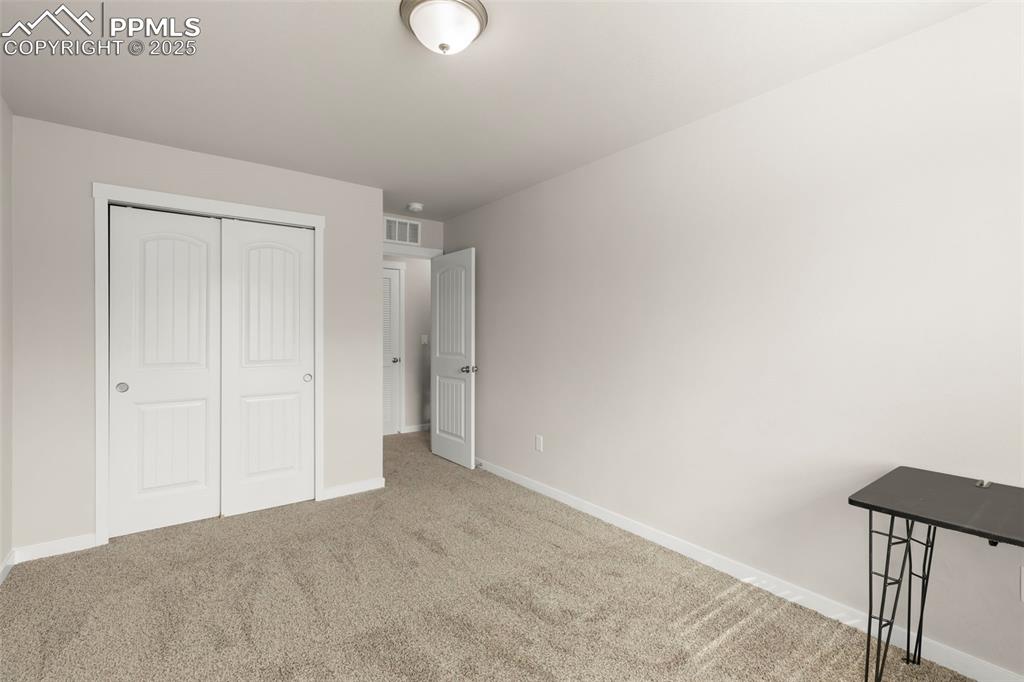 Image 24 of 27: Unfurnished bedroom featuring carpet floors and a closet
