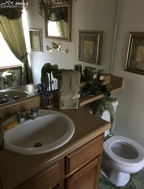 Image 11 of 20: Bathroom featuring vanity and toilet