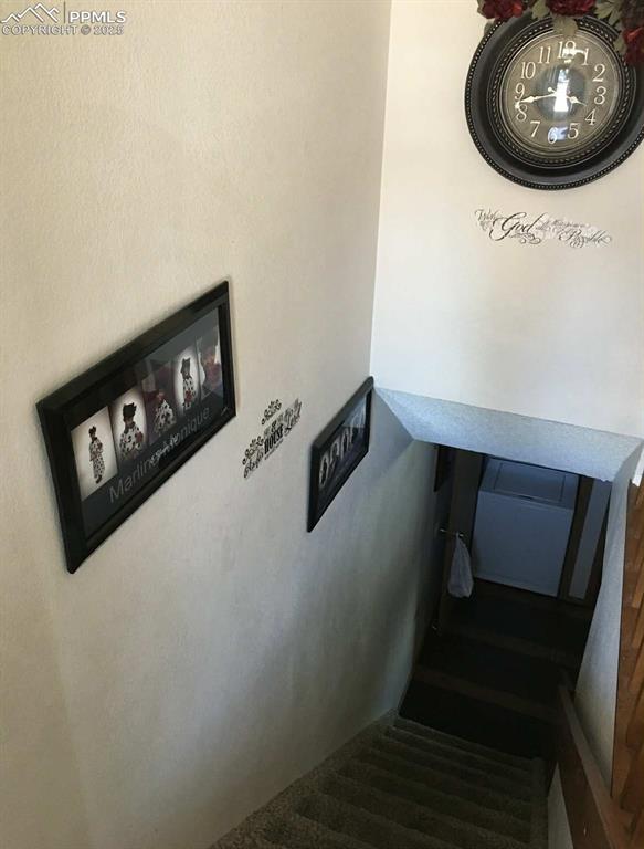 Image 12 of 20: Staircase featuring carpet