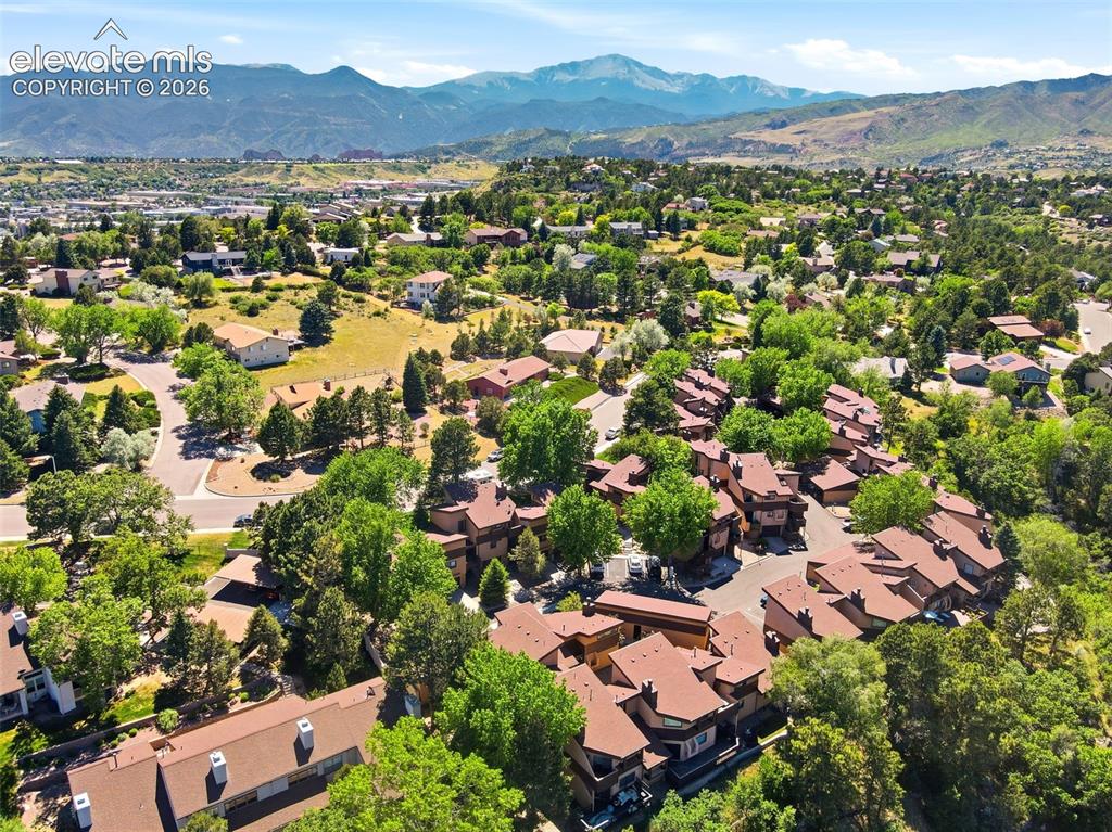 Image 19 of 19: Aerial perspective highlighting a residential community with abundant matur