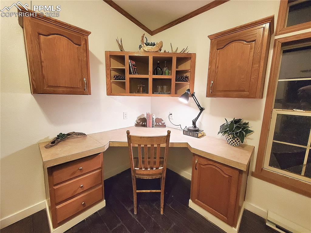 Image 14 of 50: Great built in desk and storage cabinetry to set up your private office wit