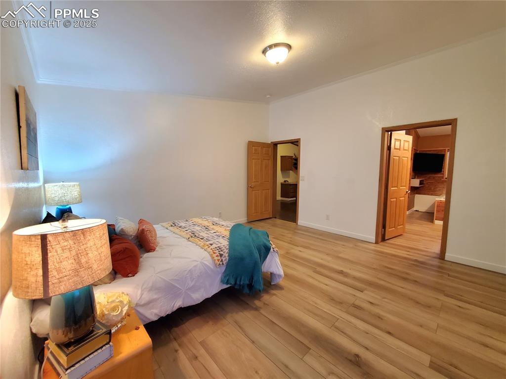 Image 16 of 50: Door to the left is the entry into master bedroom from office, door to righ