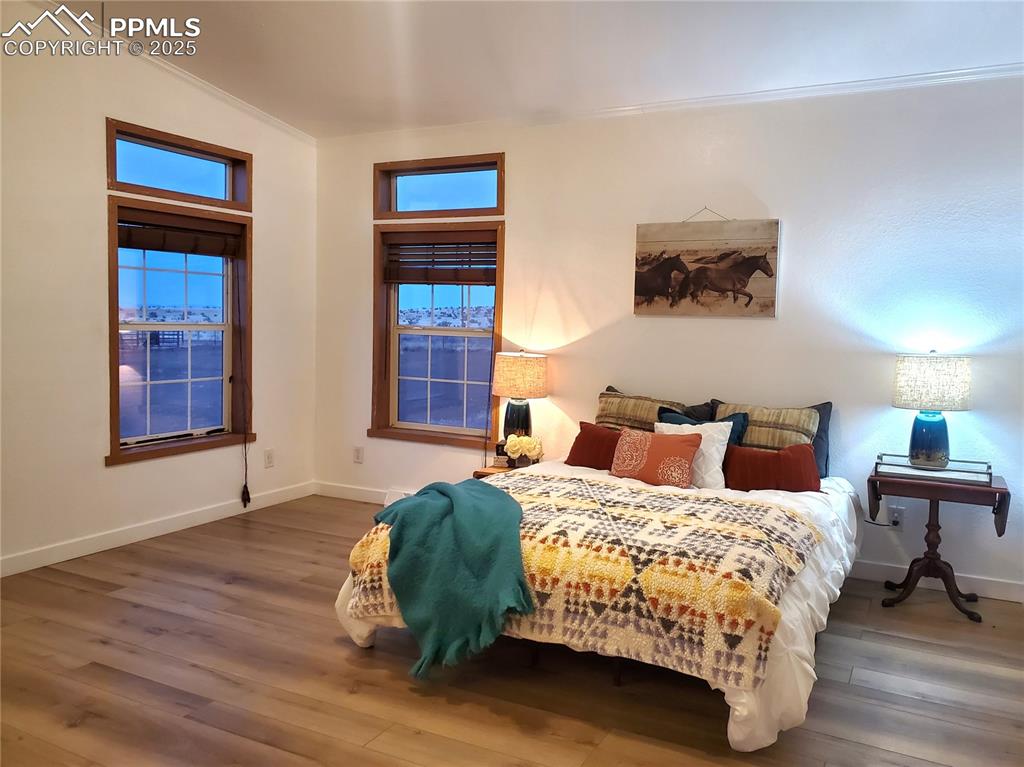 Image 4 of 50: Spacious yet cozy master bedroom is in its own suite, beginning with the of