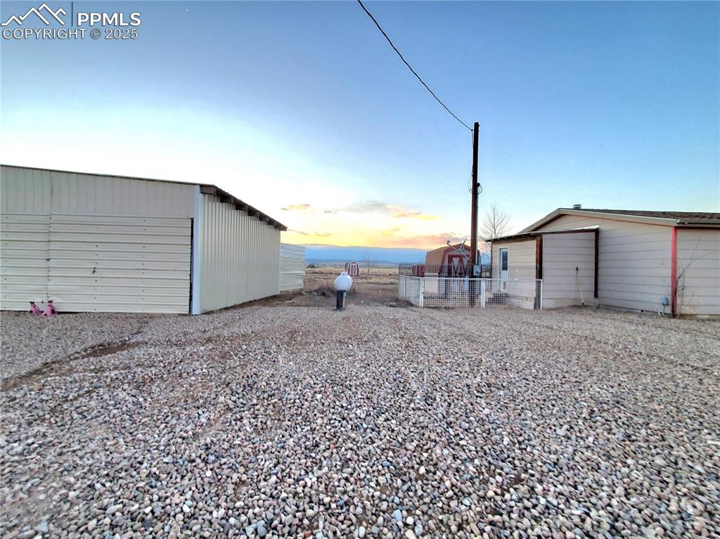 Image 47 of 50: Additional storage shed near the  fenced dog yard