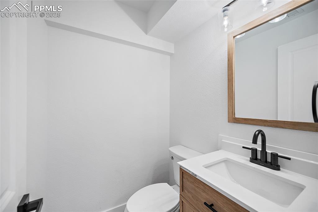Image 29 of 48: half-bath located off of Den