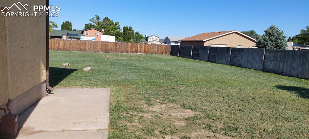 Image 5 of 46: View of side and back yard