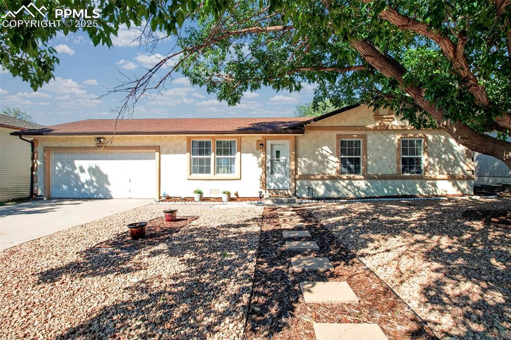 Caption: Beautiful stucco home with 2 car garage!