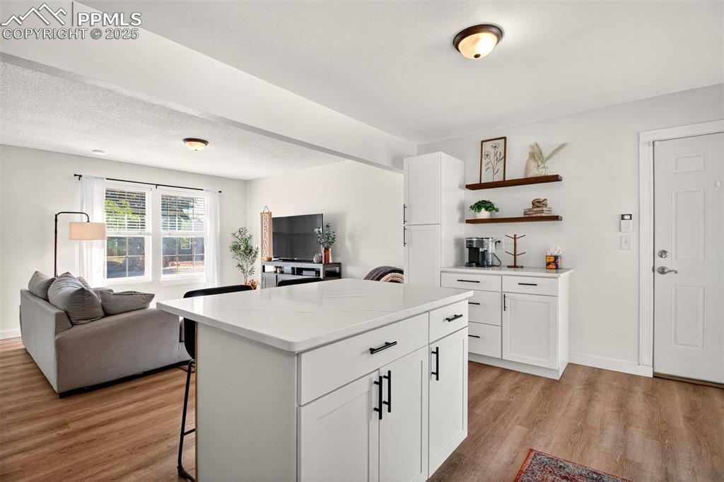 Image 7 of 29: Open kitchen, decorative shelves