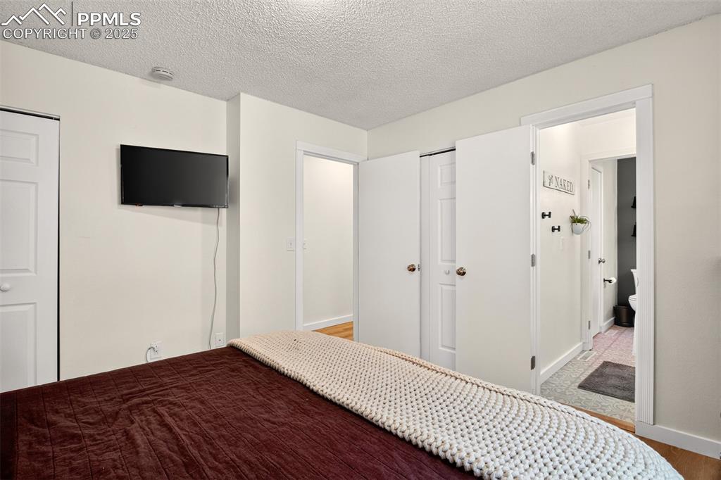 Image 9 of 29: Master bedroom looking towards bathroom