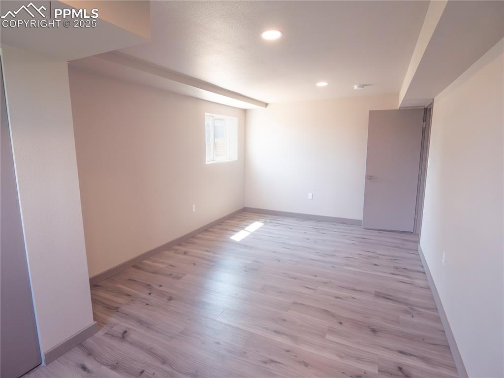 Image 18 of 39: Spare room featuring light wood-style flooring and recessed lighting