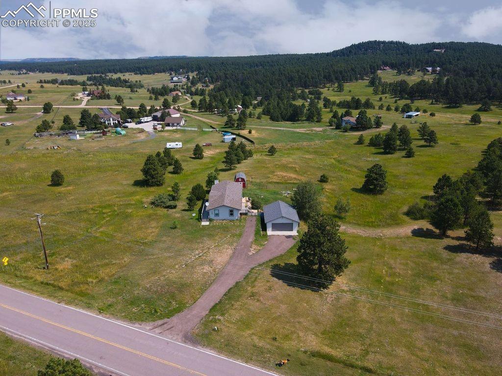 Image 39 of 39: Aerial view of property and surrounding area with rural landscape