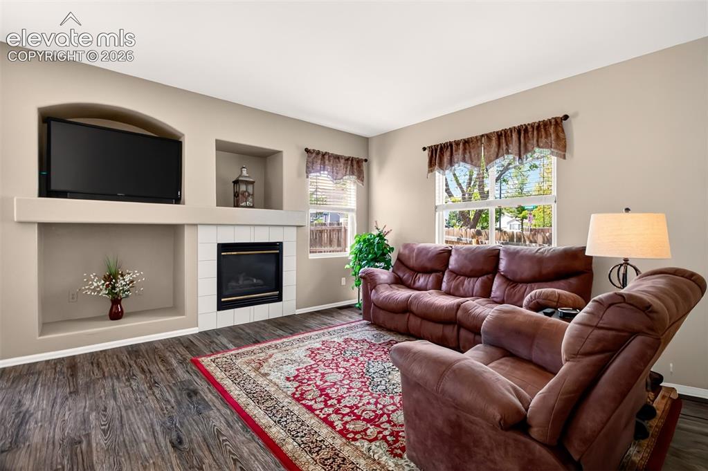 Image 6 of 46: Gas log fireplace, LVP flooring