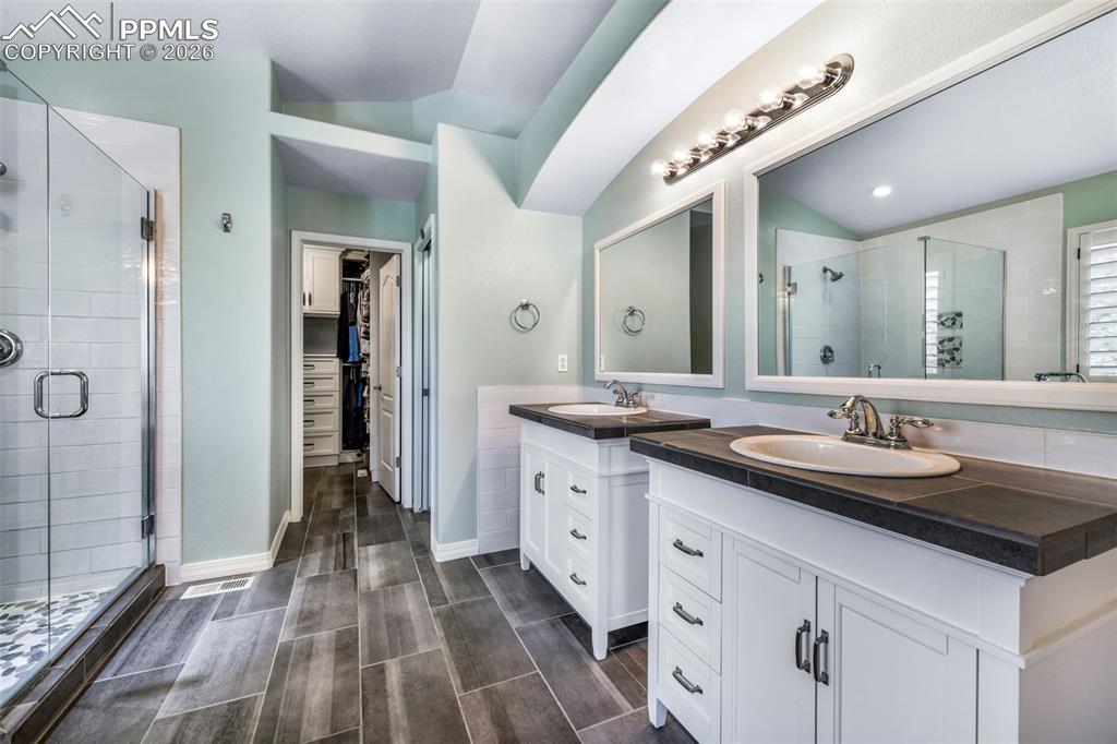 Image 21 of 50: Primary suite with luxurious five-piece en-suite bath and private balcony