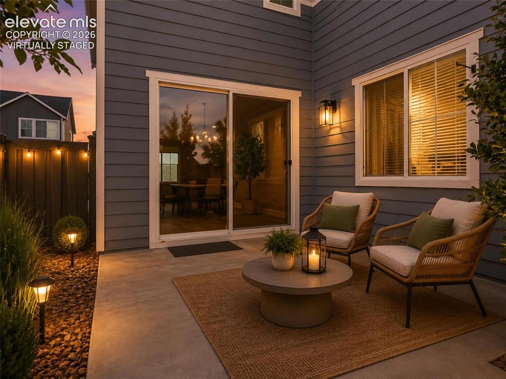 Image 14 of 40: Concrete patio featuring a sliding glass door
"Virtually Staged"