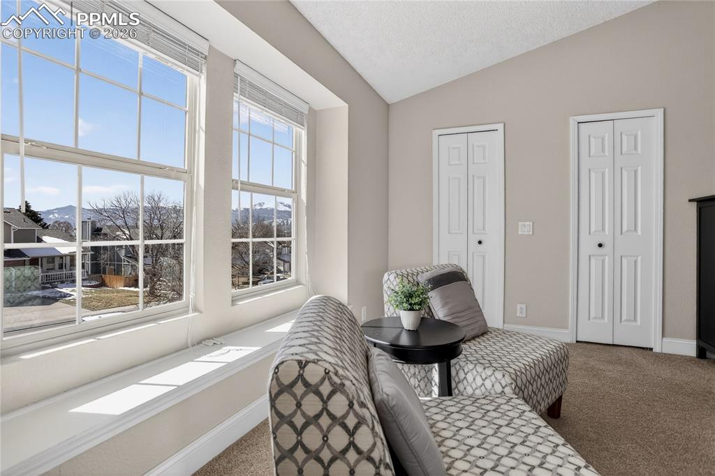 Image 13 of 28: Sitting area w/ views to mountains