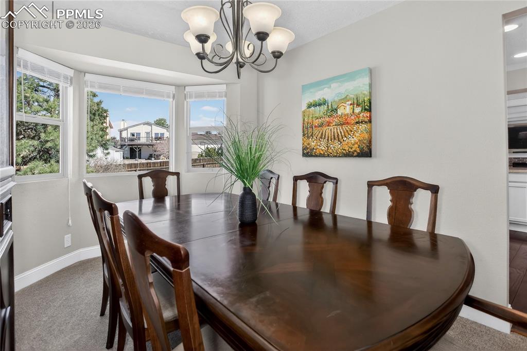 Image 4 of 28: Formal dining room w/ bay window
