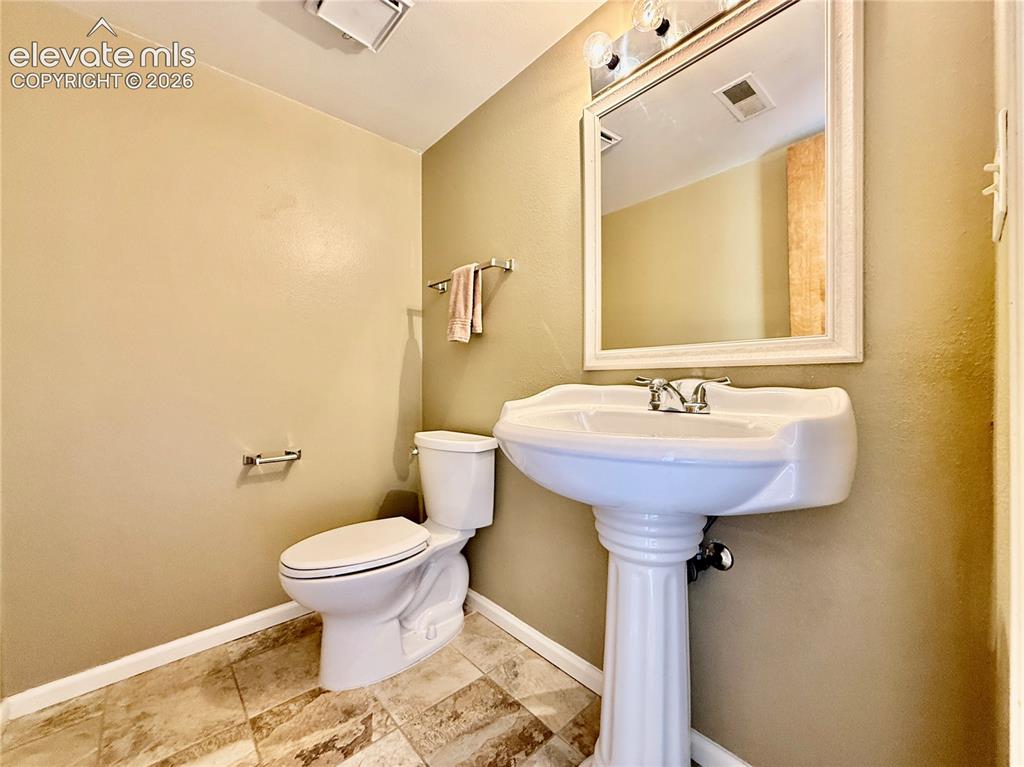 Image 11 of 26: Bathroom with toilet and baseboards