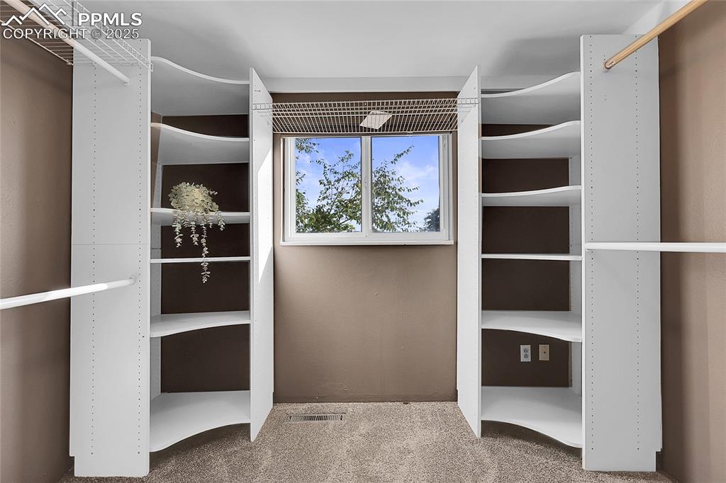 Image 18 of 36: Spacious closet featuring carpet floors