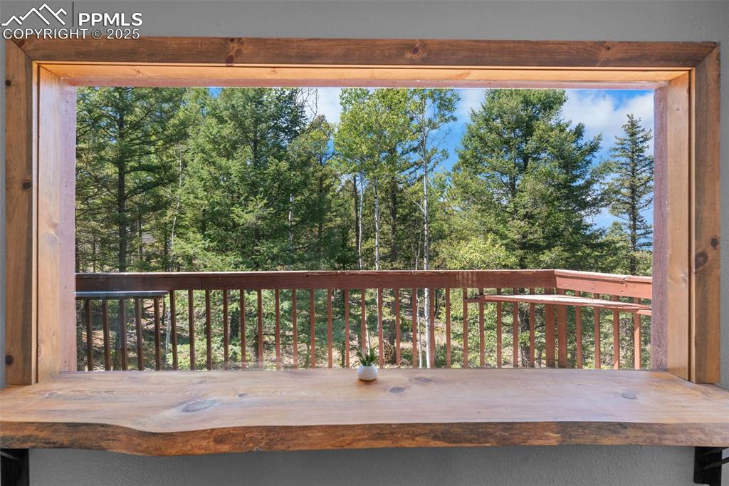 Image 11 of 46: Live edge bar brings the outdoors in