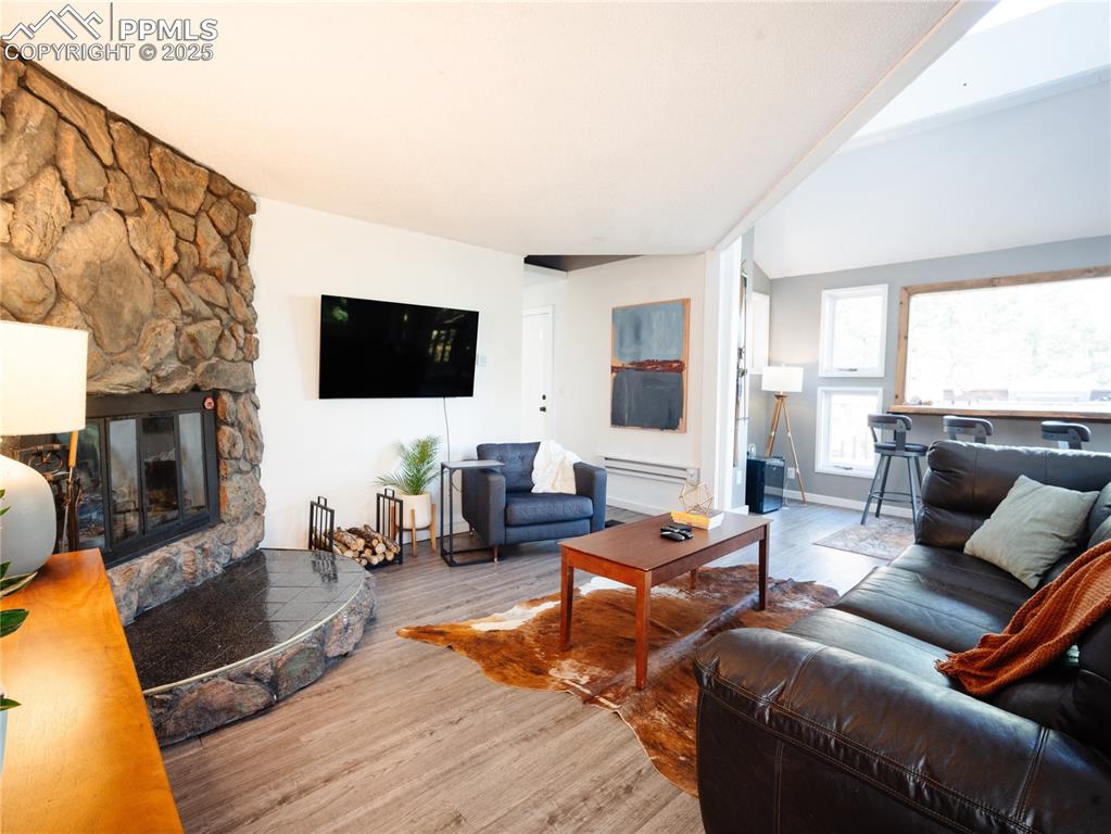 Image 15 of 46: The open living space is fabulous for entertaining and opens to the deck