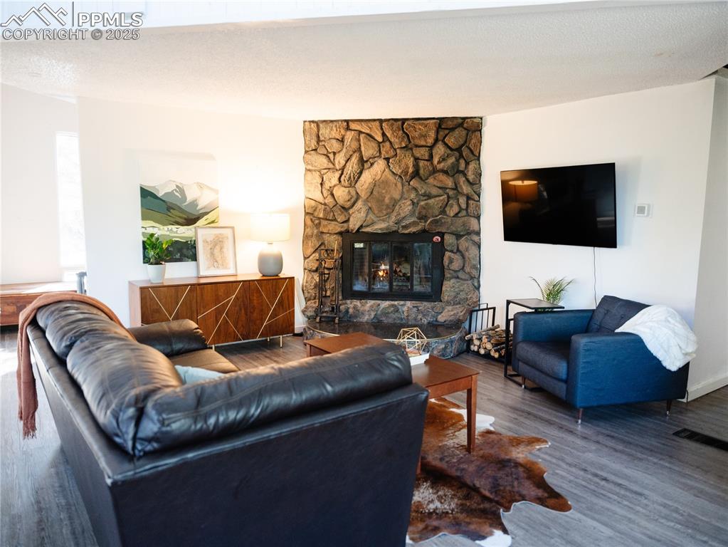 Image 16 of 46: Cozy up to the wood burning fireplace on winter evenings