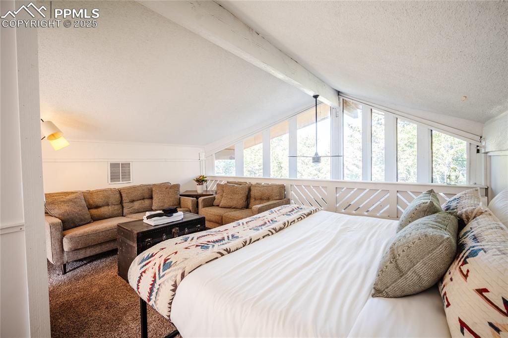 Image 24 of 46: Wake up in your airy lofted primary bedroom.