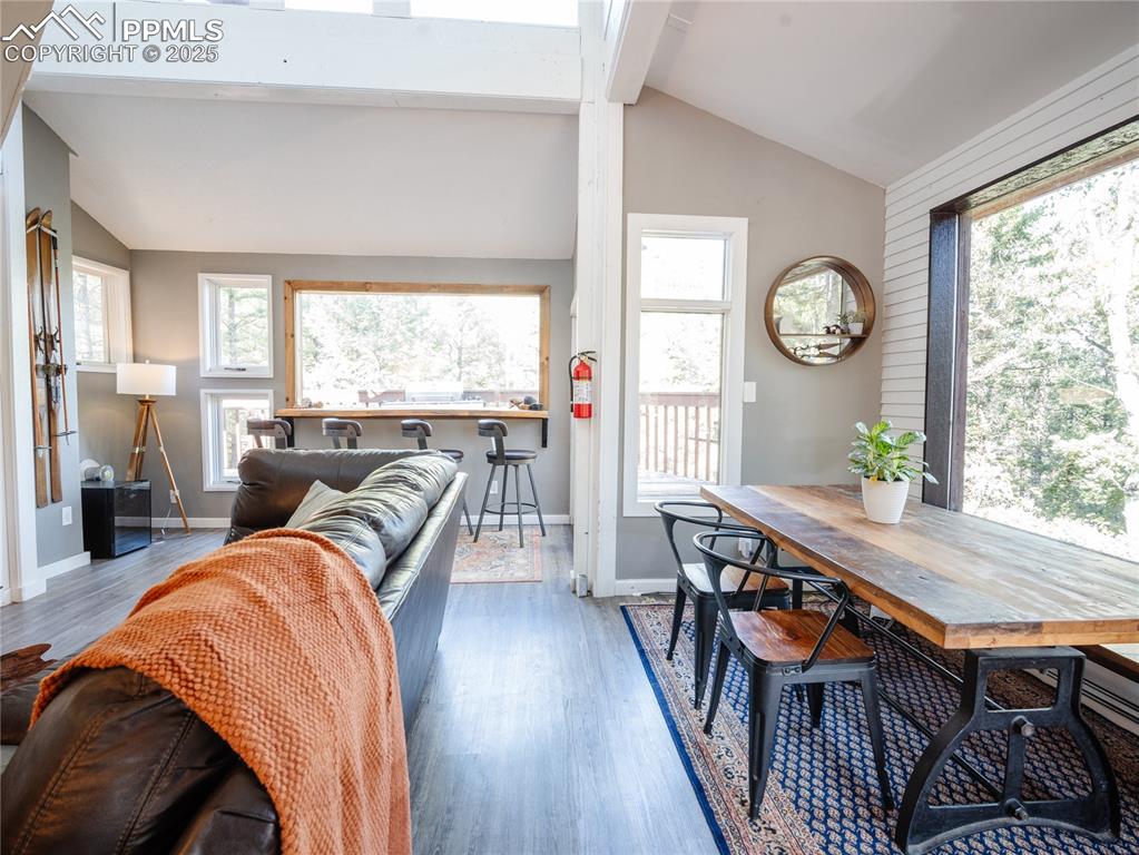 Image 9 of 46: Open living space with scenic dining and breakfast bar