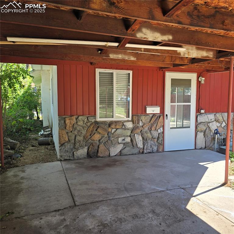 Image 22 of 28: Covered patio/carport