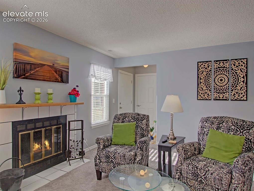 Image 8 of 13: wood fireplace ,mantel and granite tile