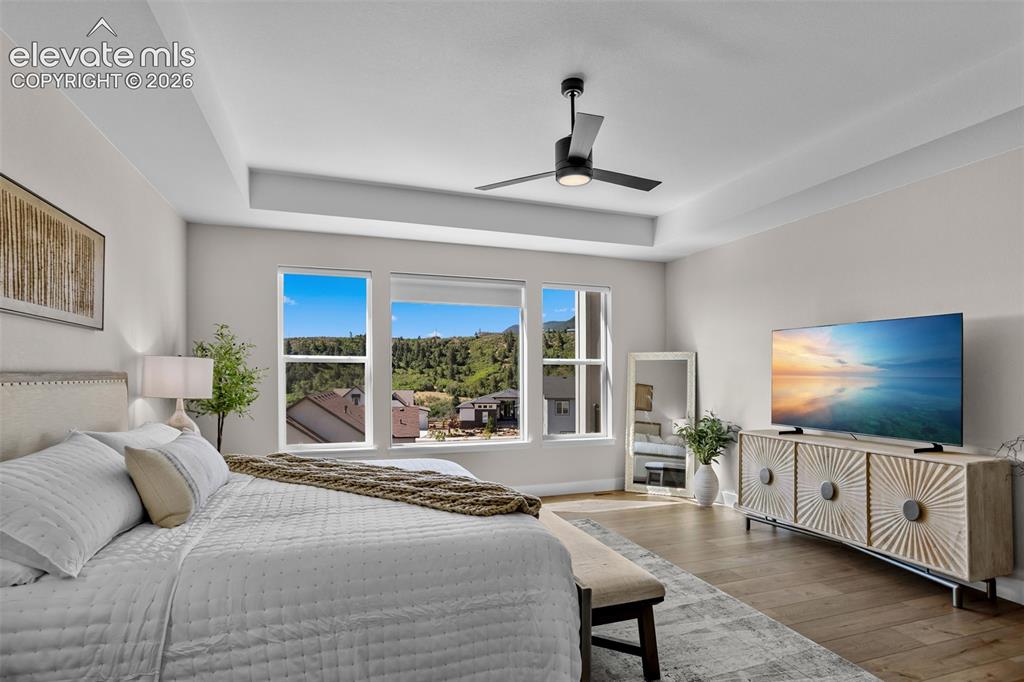 Image 10 of 29: A primary bedroom with a view