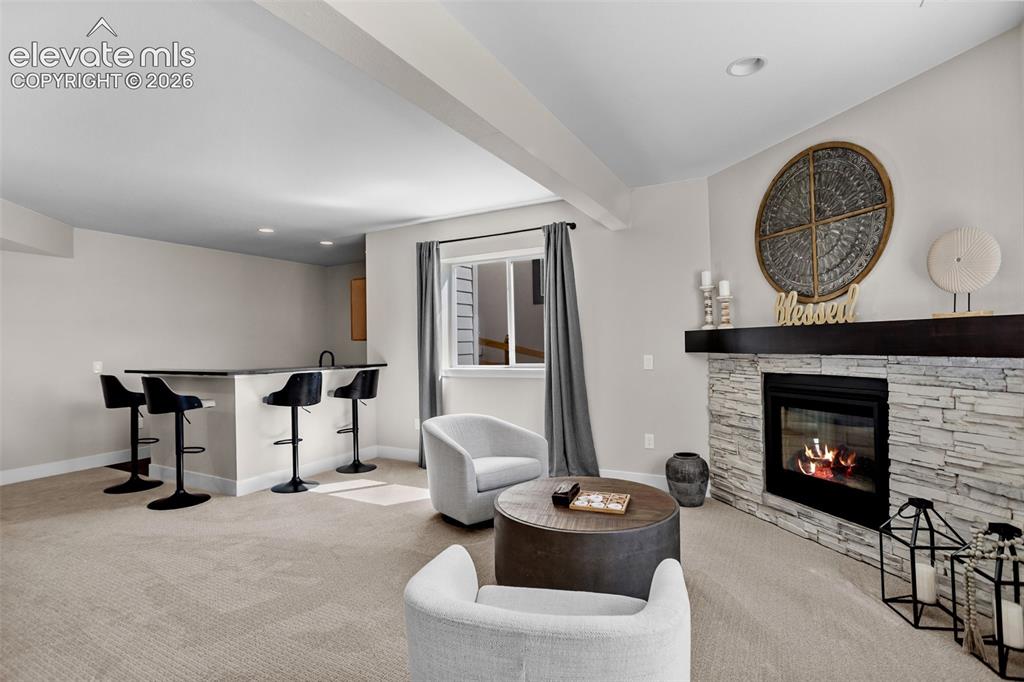 Image 21 of 29: A second fireplace in the walkout basement