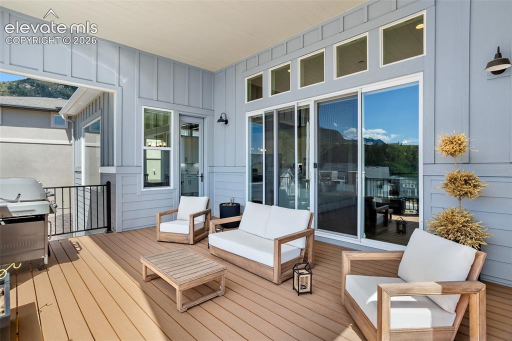 Image 22 of 29: Main level covered deck