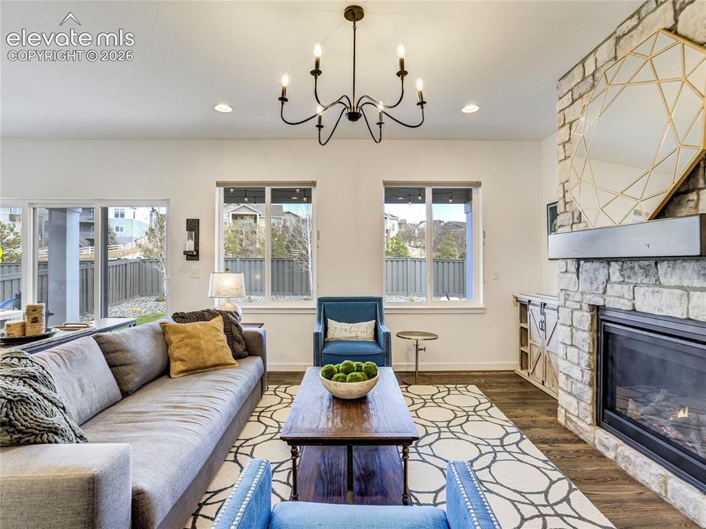 Image 11 of 50: The main level living room brings comfort & style together with a stacked s
