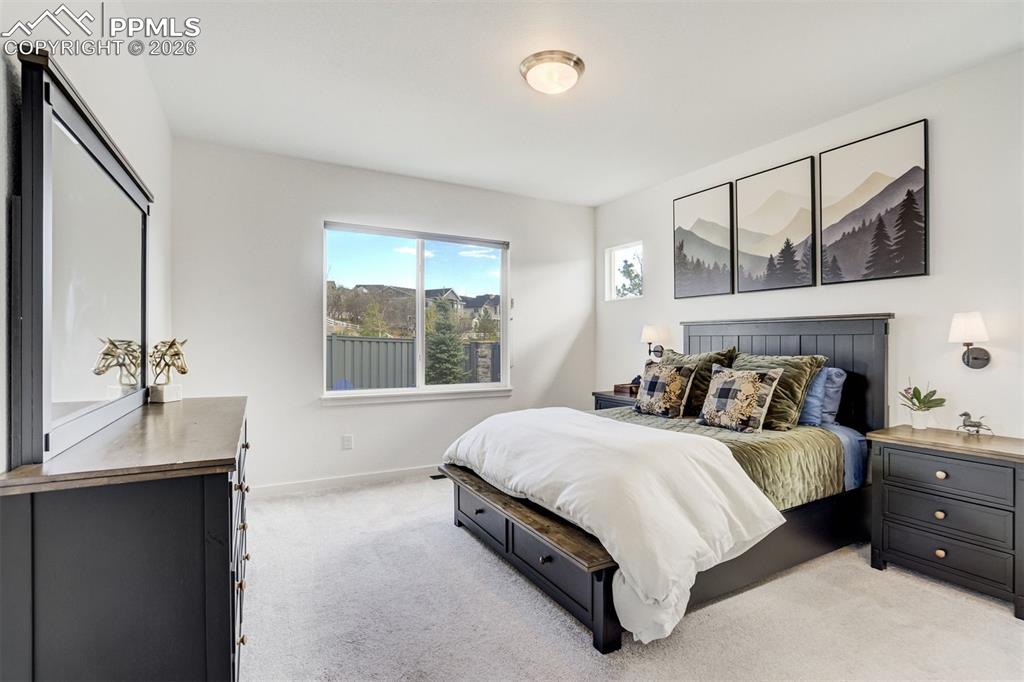 Image 21 of 46: The mani-level living room is bright & open