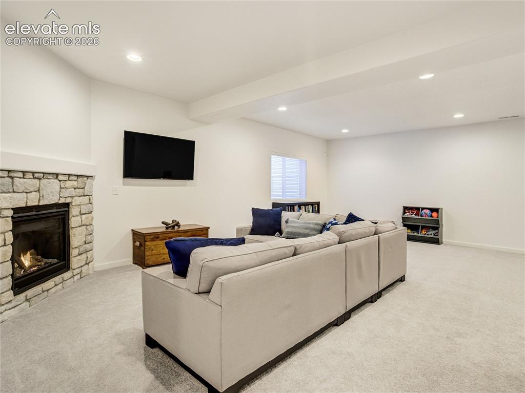 Image 29 of 50: Downstairs, the family room is spacious enough to offer fun zones or a home
