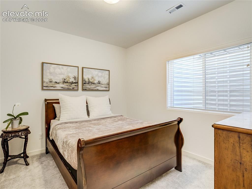 Image 35 of 50: Private guest room with walk-in closet