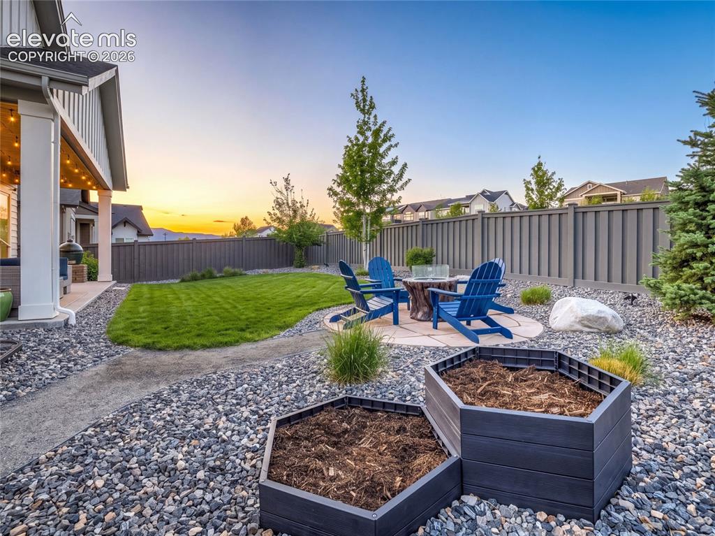 Image 7 of 50: Year-round enjoyment is just outside in the fully-fenced back yard