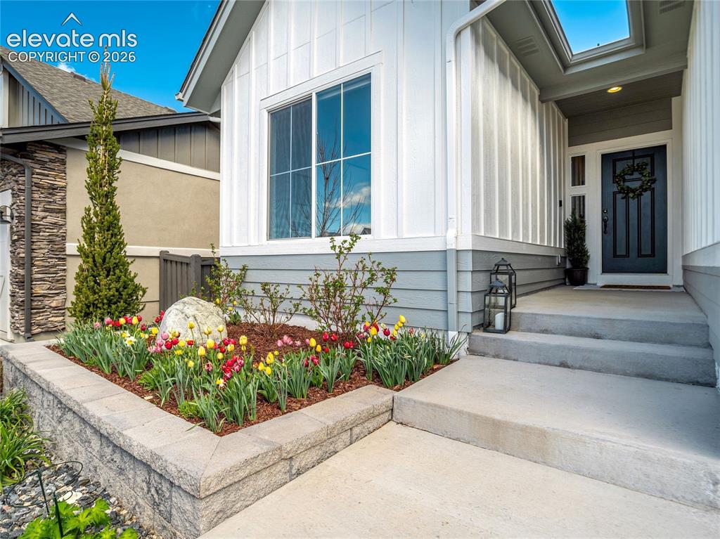 Image 8 of 50: Seasonal color adds to the curb appeal leaving room to put your personal to
