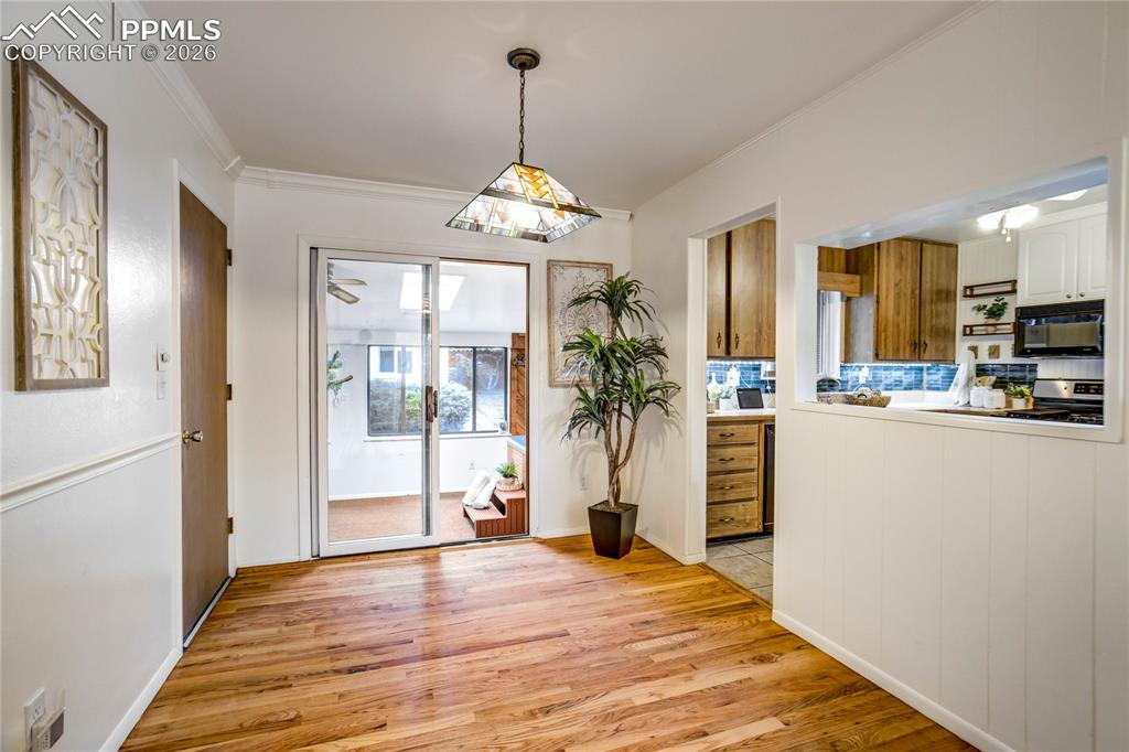 Image 6 of 41: Living room flows to the dining space
