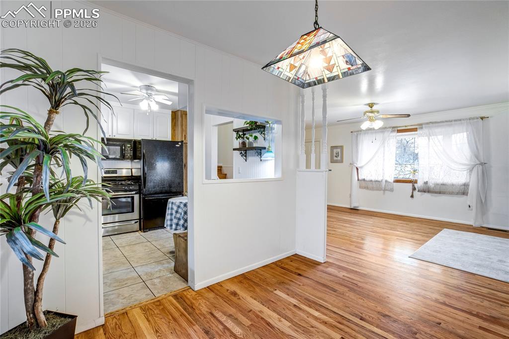 Image 7 of 41: View into kitchen and finished sun room