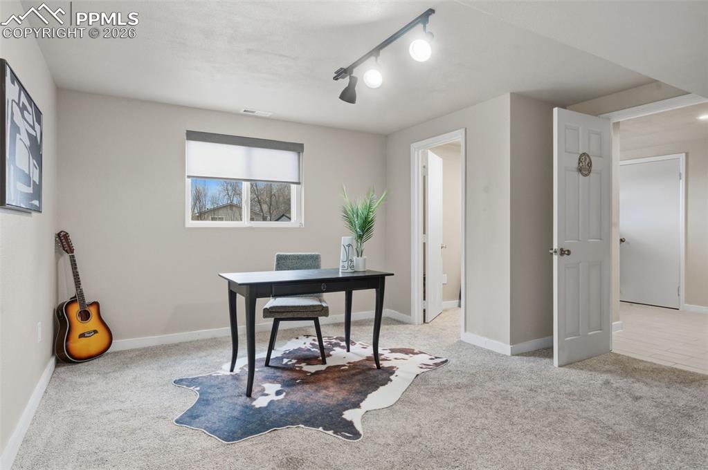 Image 26 of 50: Basement bedroom toward back yard