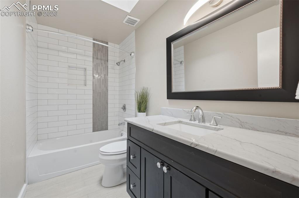 Image 38 of 50: Upstairs hallway bathroom