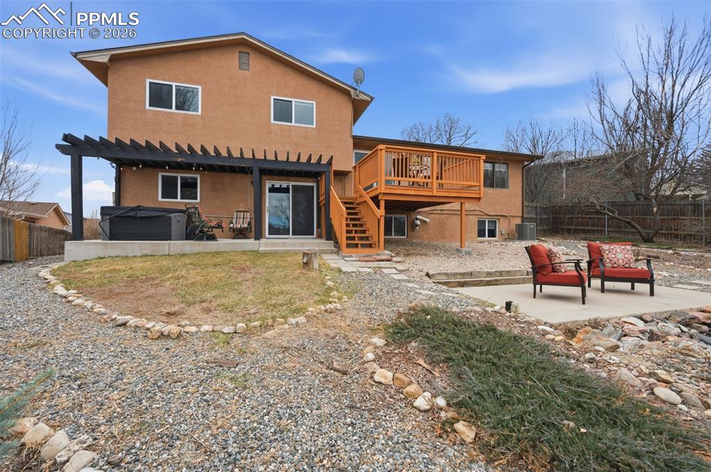 Image 44 of 50: Backyard wide view of house