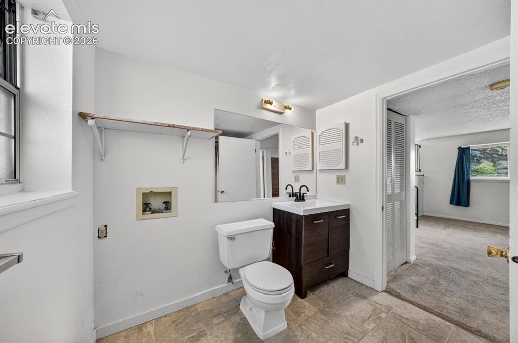 Image 24 of 30: Lower level 3/4 bath - shower is on opposite wall.