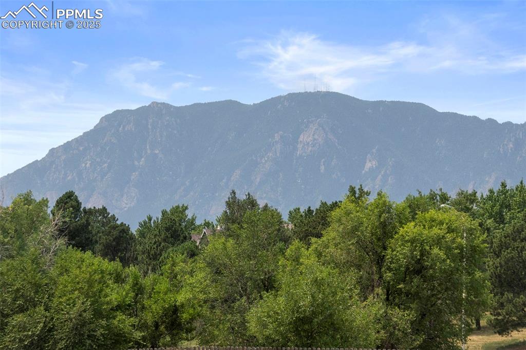Image 14 of 15: Mountain view with a heavily wooded area