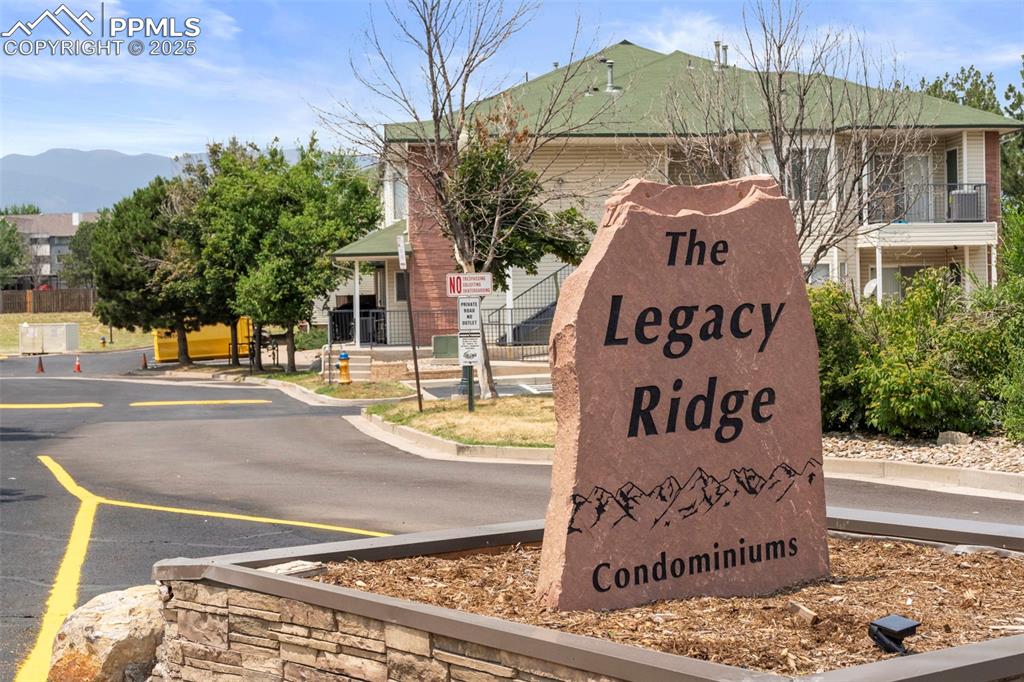 Image 15 of 15: Community sign with a mountain view
